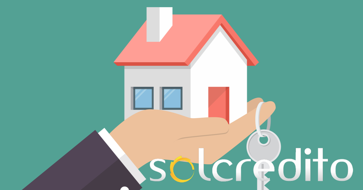ilustracion de una casa y unas llaves en una mano con logo de solcredito